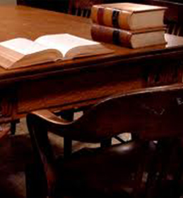 Open Law Book In a Courtroom